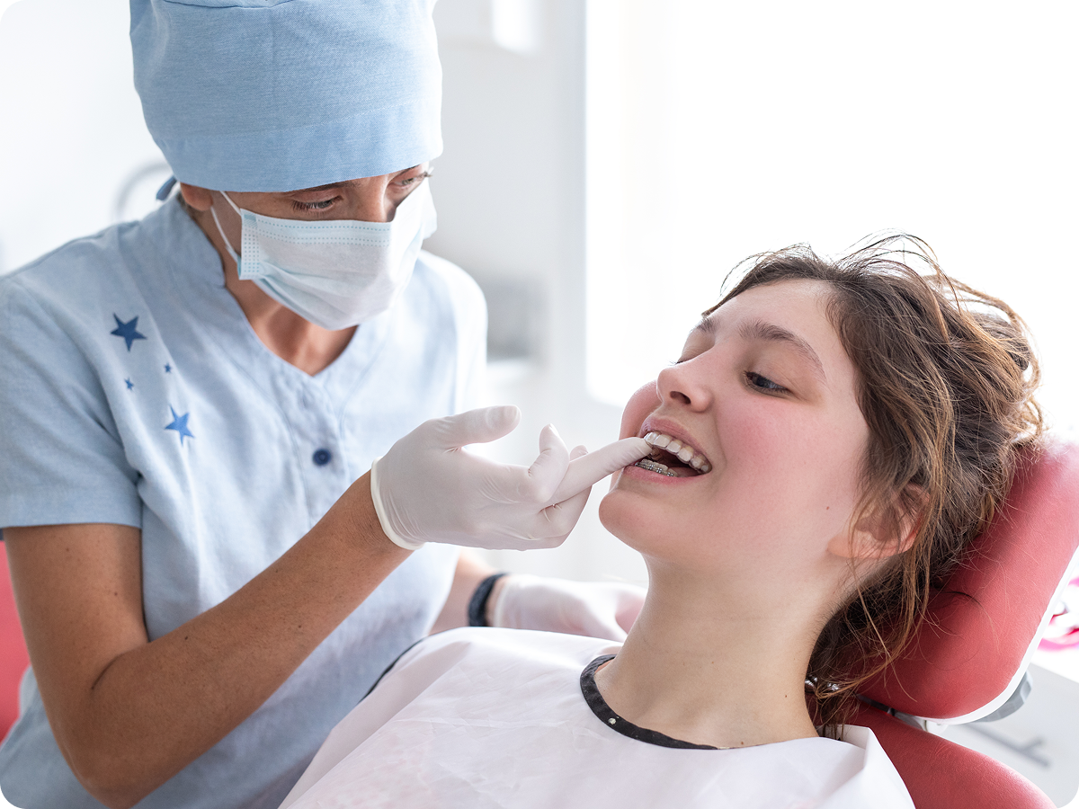 Dentist examining a patient's teeth.